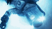 a person is swimming in the water with a light shining on them