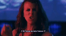a woman singing a song with the words et l' envie de faire l' amour written below her