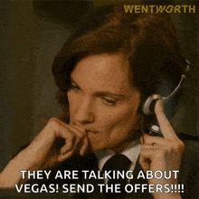 a woman wearing headphones says they are talking about vegas send the offers !!!