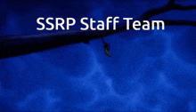 a blurry picture of a building with the words ssrp staff team written on it