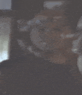 a blurry picture of a man wearing a helmet and goggles