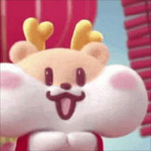 a close up of a stuffed animal with antlers and a bow tie .