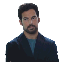 a man with a beard wearing a suit and a blue shirt