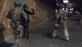 a group of soldiers are standing next to each other in a room .