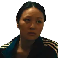 a close up of a woman 's face with a adidas jacket on