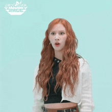 a woman with red hair is standing in front of a singing race logo