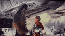 a chewbacca and a man are standing under a fighter jet
