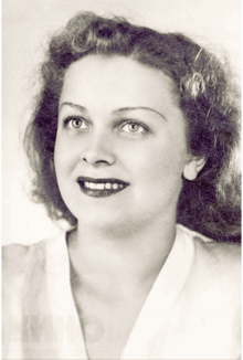 a black and white photo of a woman with curly hair