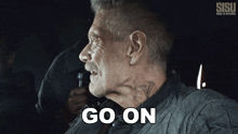 a man with a mustache says go on in a sisu ad