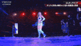 a female wrestler is giving a thumbs up sign