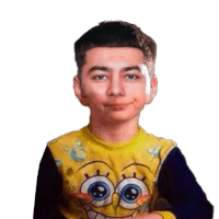 a young boy wearing a yellow spongebob shirt looks at the camera
