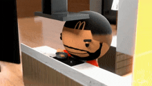 a cartoon character with a m on his head is cooking
