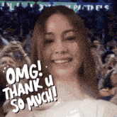 a woman says " omg thank u so much " in front of a crowd of people