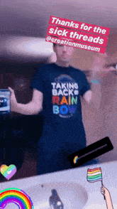 a man wearing a shirt that says taking back rainbow bow