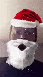 a man wearing a santa hat and beard looks surprised