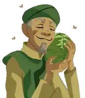 a man in a green hat is holding a cabbage in his hands and smiling