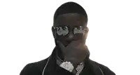 a man wearing sunglasses and a watch is covering his face with his hands .