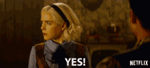 a woman says yes in front of a man in a netflix ad