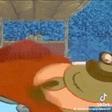 a close up of a cartoon character 's face with a frog on it .