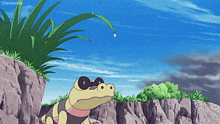 a cartoon of a crocodile on a rocky cliff with clemontic written on the bottom