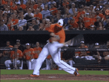 a baseball player is swinging at a ball in front of a bank of america banner