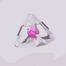 a pyramid shaped object with a pink object inside
