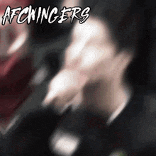 a blurry picture of a man with the words afckingers written on it