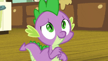 spike from my little pony has a purple tail and green spikes
