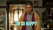 a woman says i 'm so happy in front of a living room