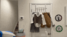 a child 's clothes are hanging on a clothes rack