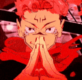 a close up of a person 's face with their hands folded in front of their face