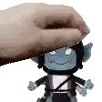 a hand is putting a stuffed toy on top of a stuffed toy .
