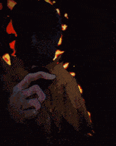 a blurry picture of a person holding a knife with the word trick written on the bottom