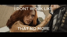 a woman with red hair is standing next to a man with a gun and the words `` i dont work like that no more ''