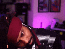 a man in a pirate costume is laying down in a living room .