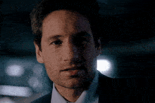 a man in a suit and tie is saying " you 're saying that this guy was selling his body parts for money ? "
