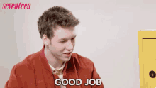a man in a red jacket says good job