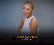 a woman in a white tank top says i don t give a fxkk