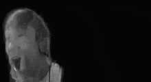 a black and white photo of a person with headphones and the words he npuu mokehhol b 3.00