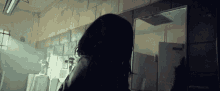 a woman looking at her reflection in a mirror in a bathroom