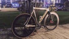 a white bicycle with the word imperium on the front