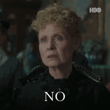 a woman in a black dress says " no "