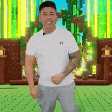 a man wearing a white t-shirt and grey sweatpants is dancing in front of a green background .