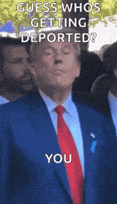 a man in a suit and tie is standing in front of a crowd and says guess who 's getting deported ? you