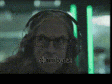 a pixelated image of a person wearing headphones with the word dumbass written below them