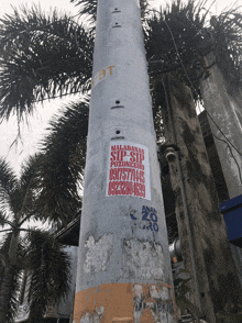 a pole has a sticker on it that says malabanan sip sip
