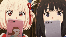 two anime girls are looking at their phones and one has an owl on it