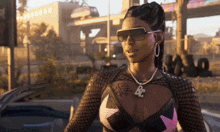 a woman wearing sunglasses and a necklace that says bc