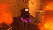 a person with a tv on their head is sitting in a room with fire