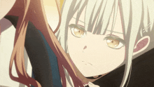a close up of a girl 's face with a serious look on her face